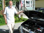 Petersburg resident Gerry Herbrandson says he pays less than two cents a mile driving his "Miles" electric car around town.